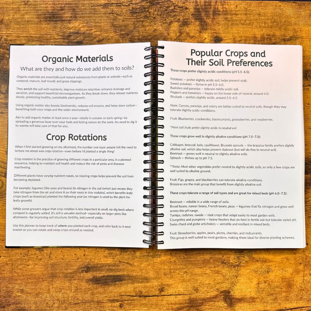 Open book on a wooden surface with text about organic materials and crop rotations.
