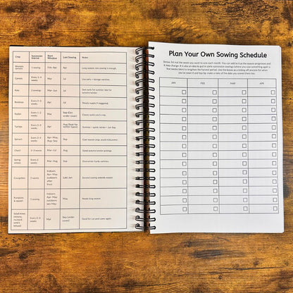 Open notebook with sowing schedule on a wooden surface